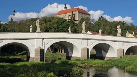 Baroque Stone Bridge With Statues Over River Facing Castle, Time lapse Stock Footage 344146209