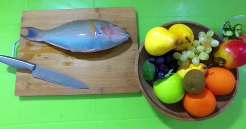 Barracuda on the cutting board  Stock Footage 76784392