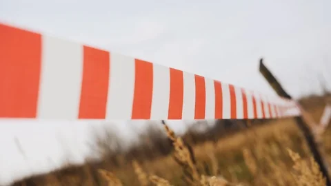 The barrage develops in the wind. Close-up of the tape. Windy weather 스톡 동영상 118710526