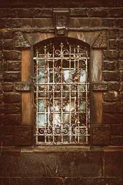 Barred cellar window Stock Photos