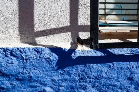 Barred window and its shadow in Alhambra Stock Photos