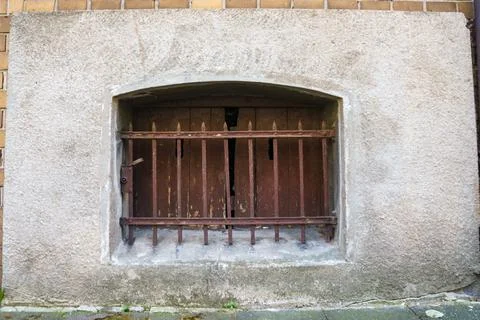Barred window to the basement. Close up. Stock Photos