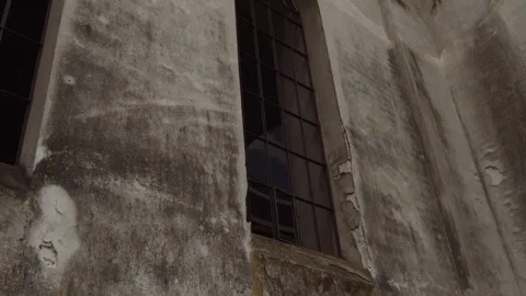 Barred window in an old abandoned stone church Stock Footage 253223805