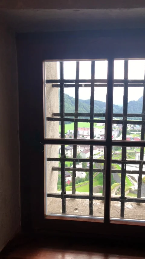 Barred window with valley view, Austria Vertical 4K Video stock 348256016