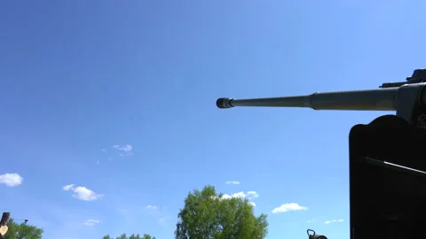 The barrel of the howitzer gun points into the clear blue sky Stock Footage 202642745