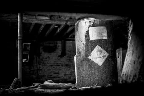 A Barrel Labelled Inflammable In An Old Abandoned Building Stock Photos