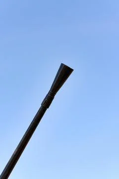 Barrel of a machine gun in a diagonal frame against a blue sky Stock Photos