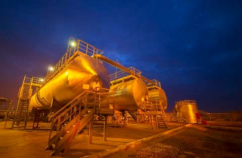 The barrel of the pipe at the refinery night Stock Photos