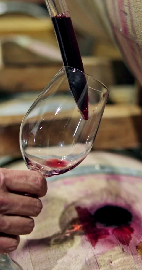 Barrel, syringe and hands with wine for glass, sample extraction and quality Stock Footage 327968041
