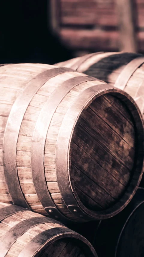 Barrels stacked in a warehouse used for aging wine and spirits Stock Footage 341023560