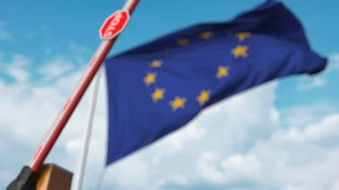 Barrier gate being closed with flag of the EU as a background. European Stock Footage 124403454