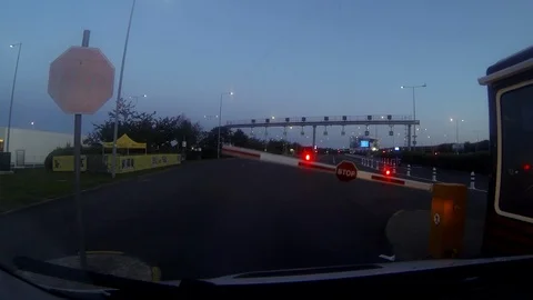 Barrier opening to allow a van in towards Eurotunnel train Stock Footage 112380866
