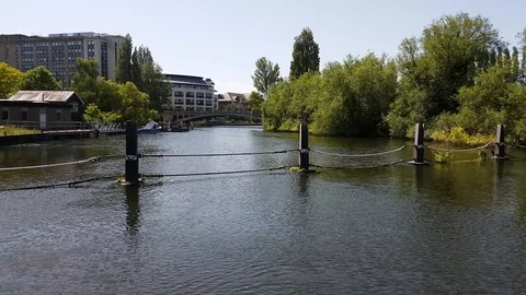 A barrier prevents boat from going over a weir on the River Thames in England, Stock Footage 111470627