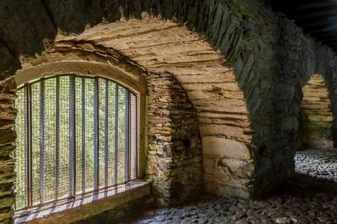 Bars and windows of underground accommodations used to imprison slaves after Stock Photos