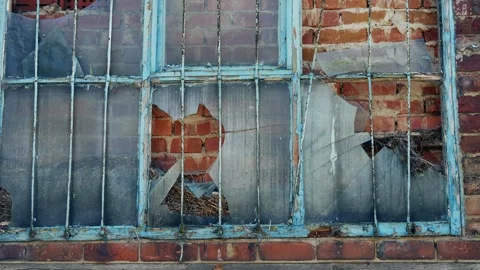 Bars on a derelict old building window wide shot Stock Footage 249687457