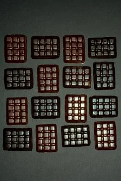 Bars of different chocolate on a black background Stock Photos