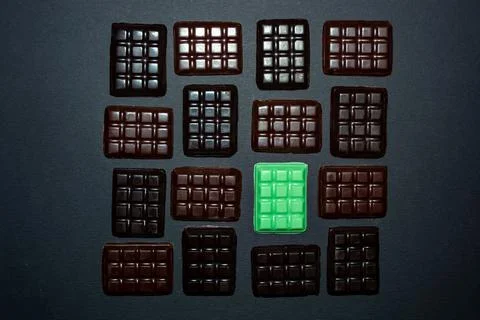 Bars of different chocolate on a black background Stock Photos