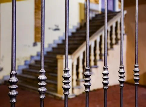 Bars of a grille with staircase in the background in the old town of Orihuela Foto stock