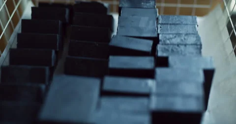 Bars of handmade, crafted soaps in bins in interior hipster soap workshop with s Stock Footage 199457454