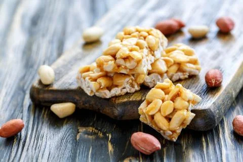 Bars of honey and peanuts. Stock Photos