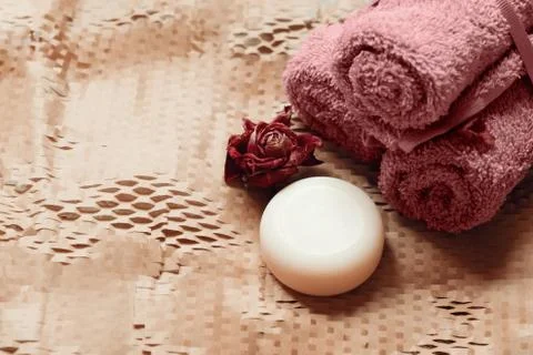 Bars of soap with bath salt and towels Stock Photos