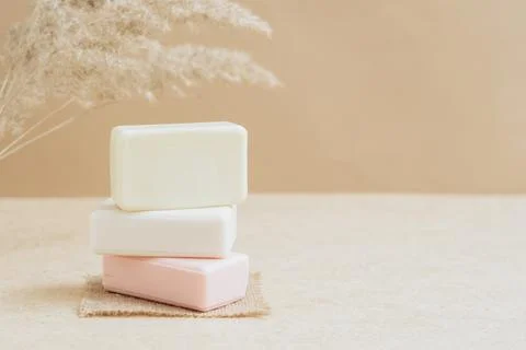 Bars of soap made from natural raw materials beige background. Organic cosmetics Stock Photos