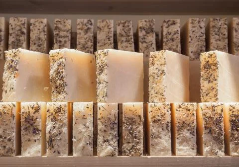 Bars of soap on a shop window. Lavender soap with natural cedar oil, turpentine Foto stock