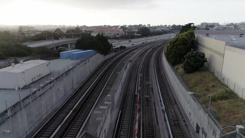 BART Commuter Train Parallel to Highway California Stock Footage 135839565