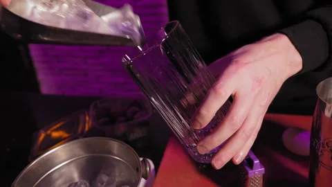 Bartender adding ice to cocktail glass Stock Footage 269559238