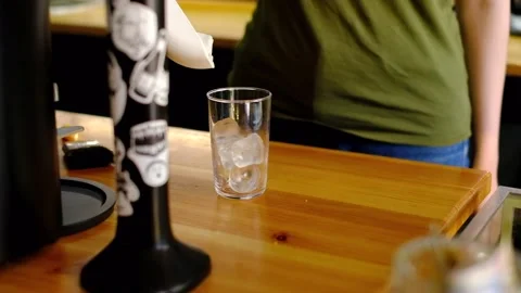 Bartender adding ice cubes into a glass Stock Footage 157277279