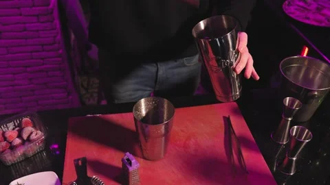 Bartender adds ice to cocktail shake takes it from metal bucket. Stock Footage 269559372