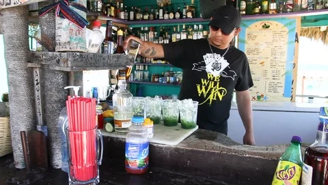 Bartender Adds Rum to Mojitos at Bar Miami - Cozumel, Mexico Stock Footage 88114880
