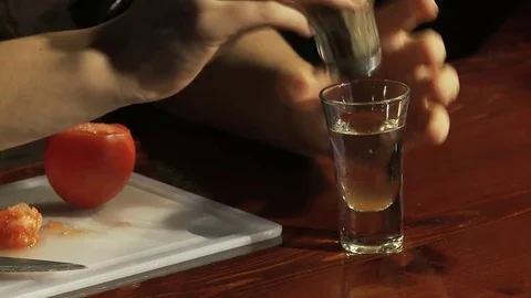 The bartender adds spices to the vodka. Stock Footage 80309649