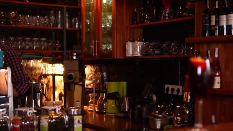 Bartender barista work place with coffee machine and wooden shelves with cups Stock Footage 104374047