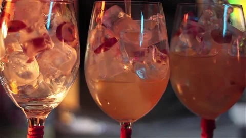 Bartender, barman is making delicious cocktail at bar counter using ice and swee Stock Footage 76473065