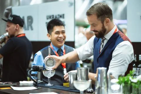 Bartender with beard preparing cocktai Stock Photos
