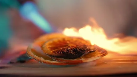 Bartender burns a lemon Stock Footage 196982006