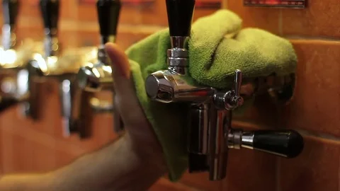 The bartender cleans beer equipment in a pub. Stock Footage 72928547