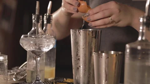 A bartender cracks an egg for a craft cocktail. Stock Footage 148098742