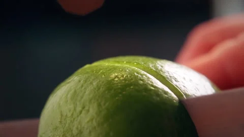 Bartender Cutting Fresh Lime on Bar Counter in Close Up Stock Footage 328978470