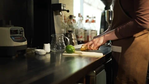 Bartender Cutting a Ginger in a Cafe Stock Footage 113137139