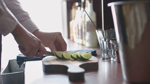 Bartender cutting limes Stock Footage 74216522