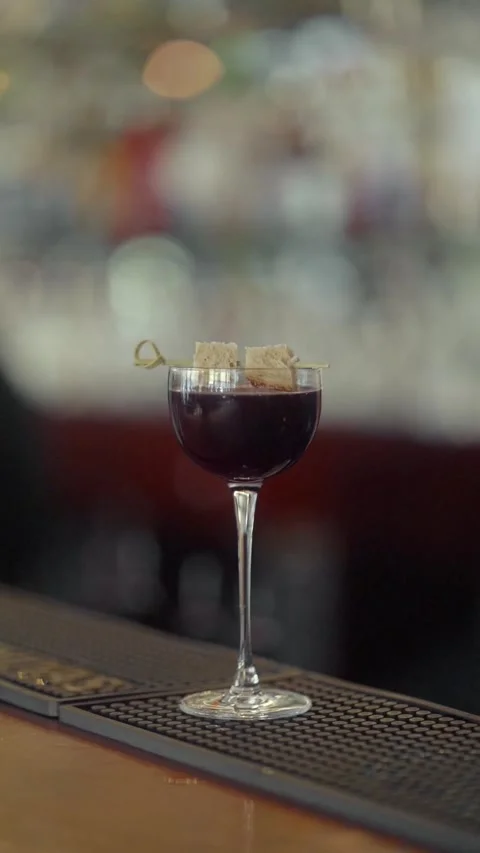 The bartender decorates the cocktail with slices of bread strung on a skewer. Stock Footage 271662054
