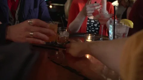Bartender delivering drink to a young man at nightclub bar Stock-Footage 82122385
