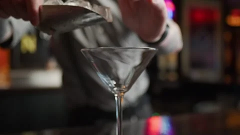 A bartender is dropping ice in an empty glass Stock Footage 301411844