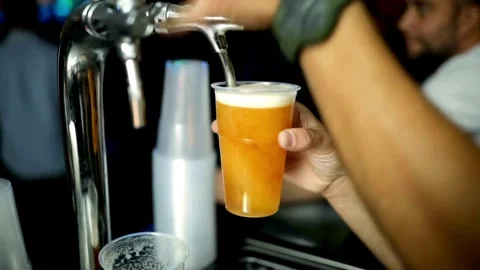 Bartender fill beer Slow Motion Macro video of beer being poured into a glass Video stock 265767727
