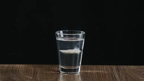 The bartender fire to an alcoholic cocktail with sambuca and Irish cream Stock Footage 132763545