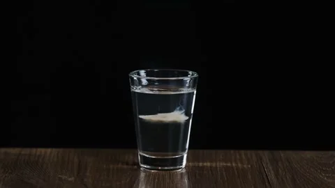 Bartender fire to cocktail with sambuca and irish cream. Flaming cocktail Stock Footage 132771817