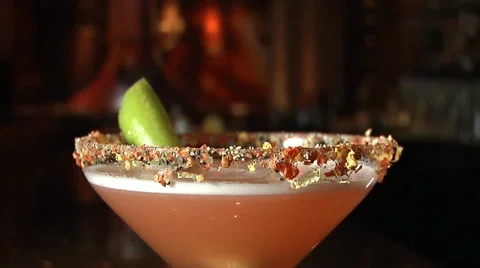 Bartender garnishes martini with a lime Stock Footage 20462333