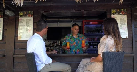 Bartender Gives Drinks to Couple at Beach Bar, Tropical Resort Stock Footage 103220431
